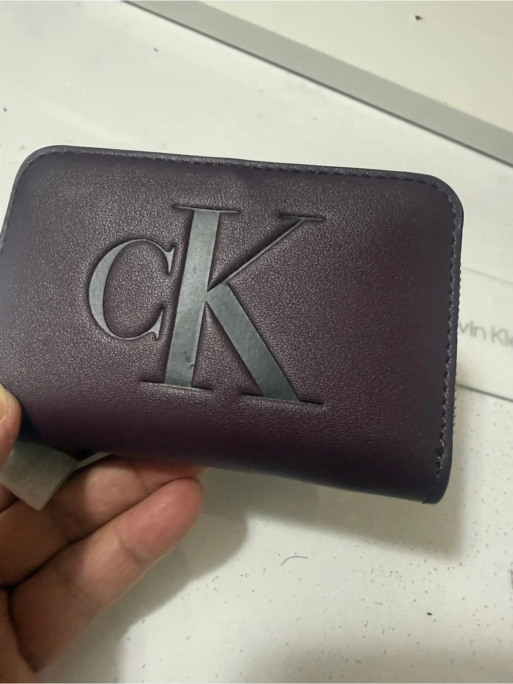 Calvin Klein Burgundy Zipper wallet with Embossed CK brand new